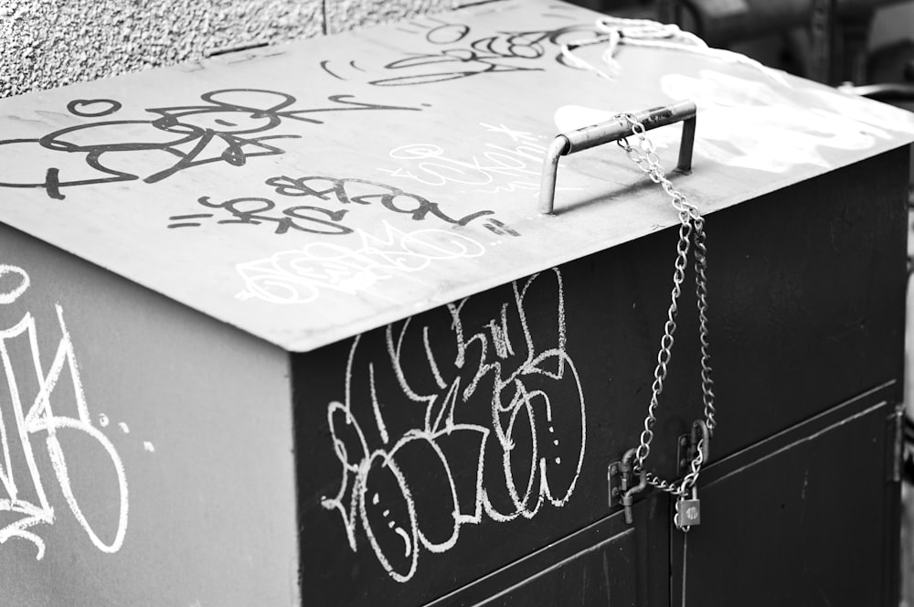 silver chain necklace on white wooden table