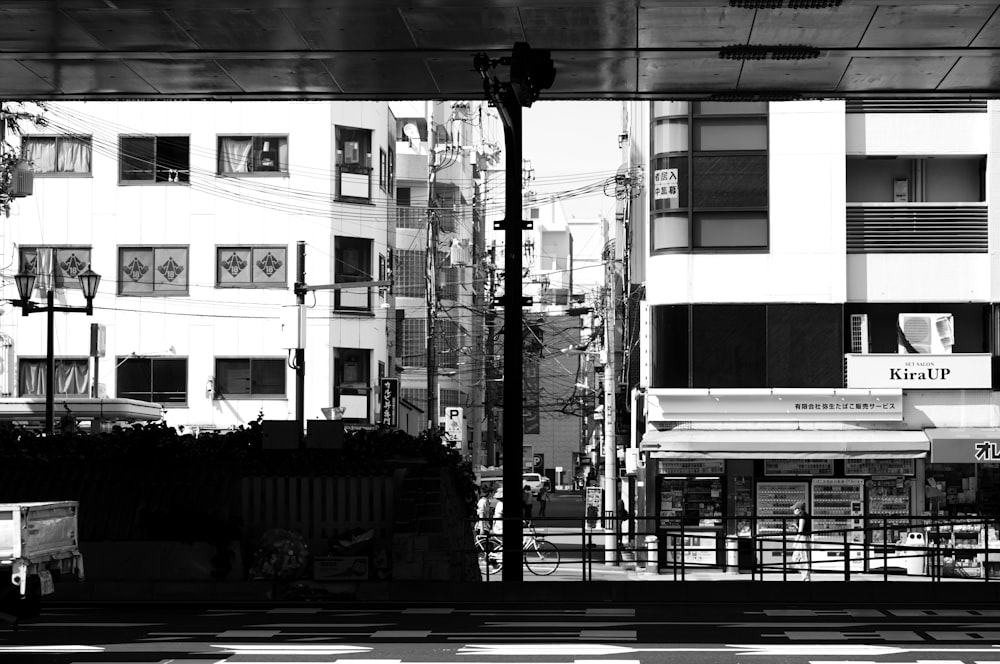 grayscale photo of city buildings