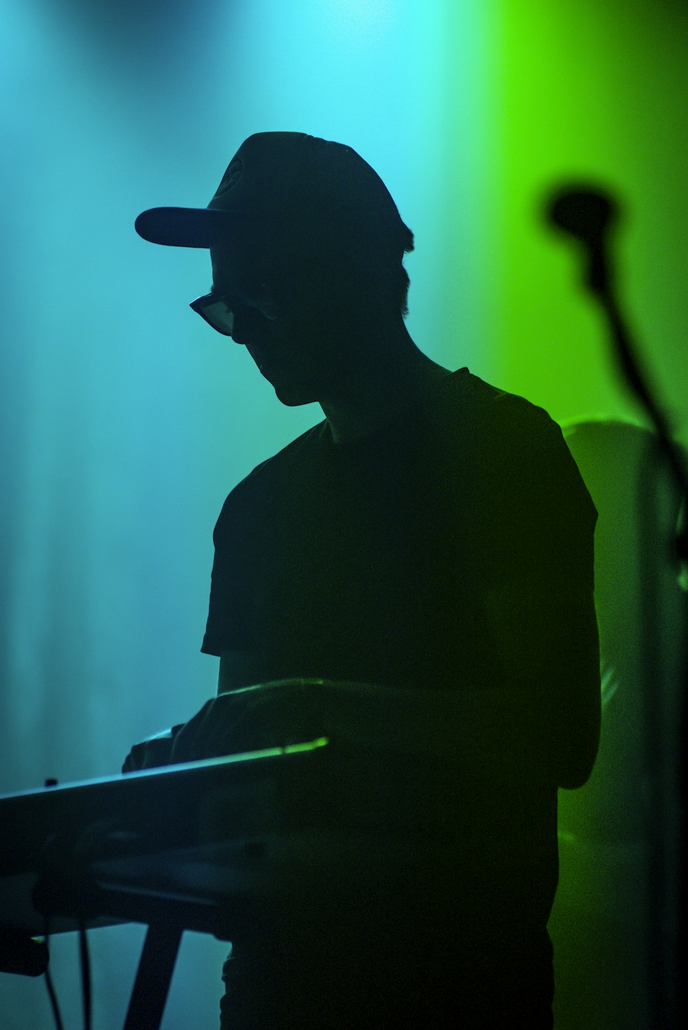silhouette of man wearing hat