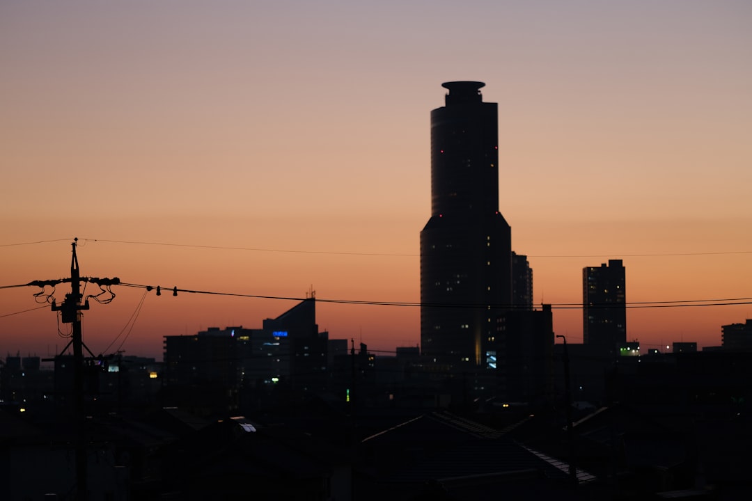 silhouette of high rise building during sunset