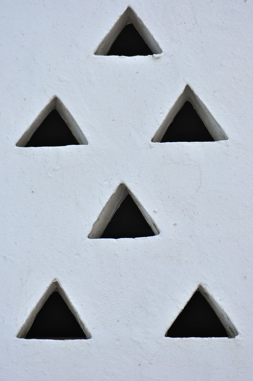 white concrete wall with brown wooden frame