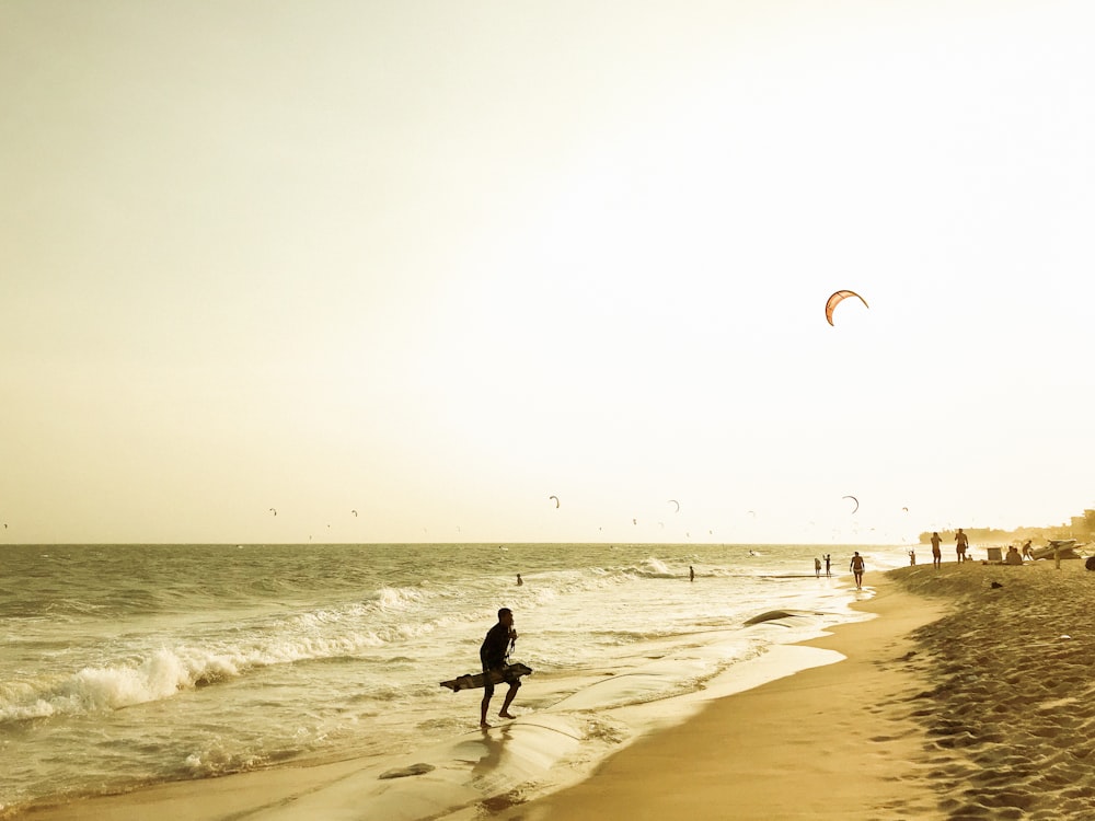 people walking on beach during daytime