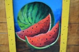 watermelon painting on brown wooden table