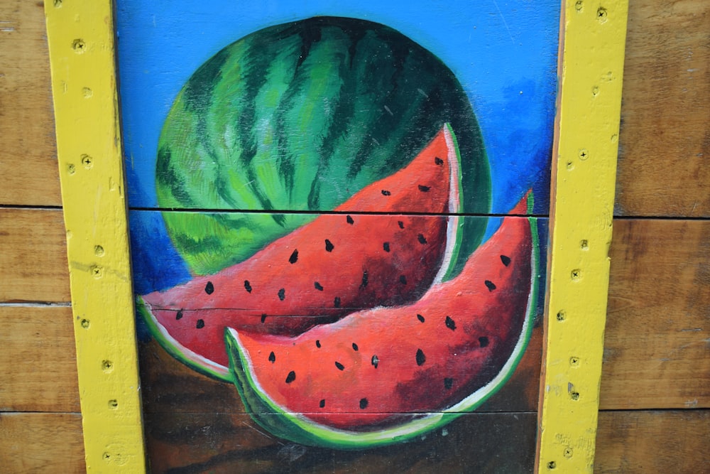 watermelon painting on brown wooden table