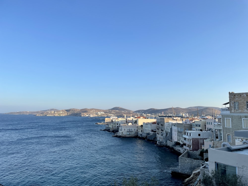 city buildings near body of water during daytime