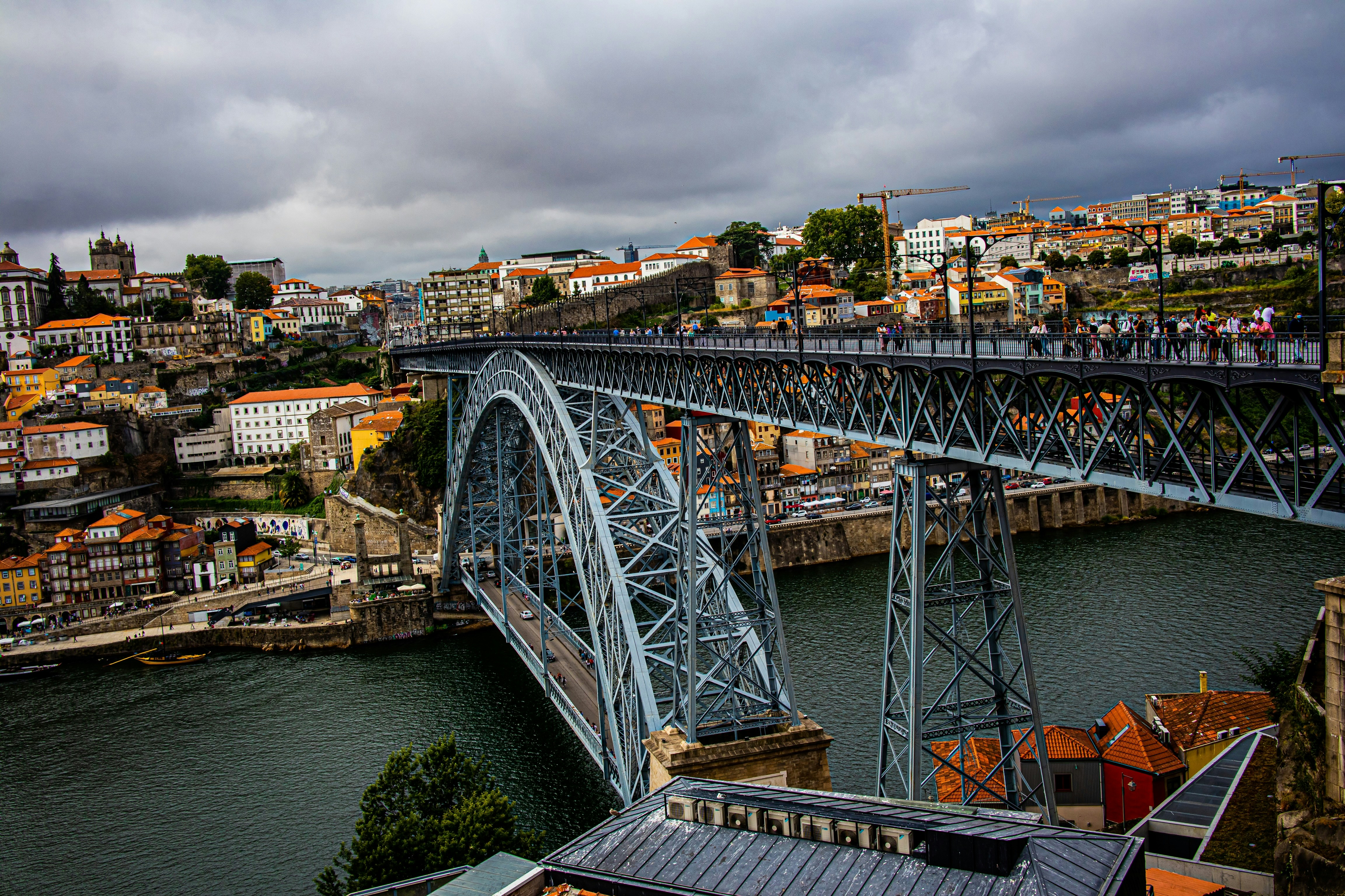 Porto Ribeira waterfront with colourful houses and Dom Luís Bridge Portugal