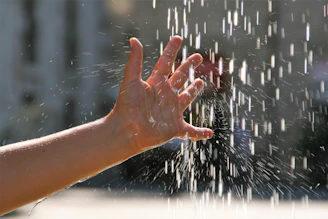 persons hand on glass window