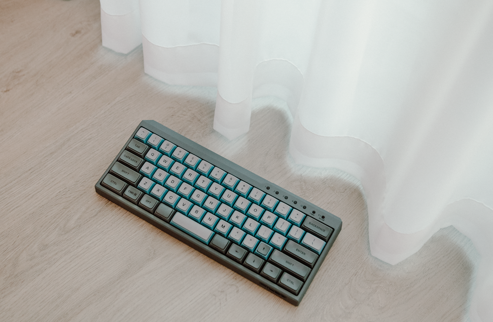 black computer keyboard on brown wooden table