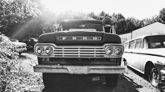 grayscale photo of classic car