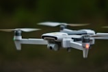 white quadcopter drone in close up photography