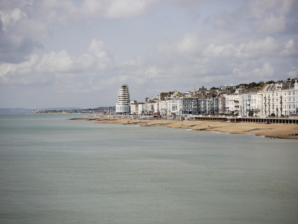 white concrete building near sea during daytime