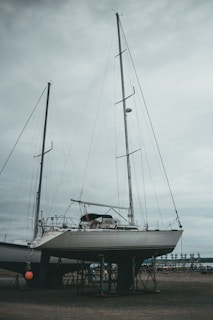 white sail boat on sea during daytime