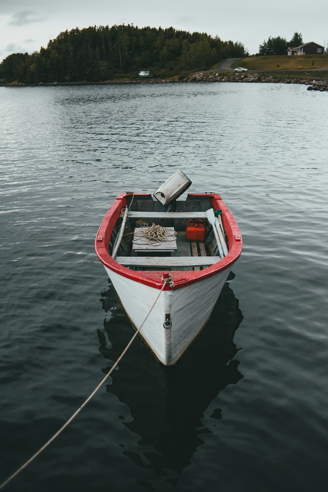 white and red boat on body of water during daytime