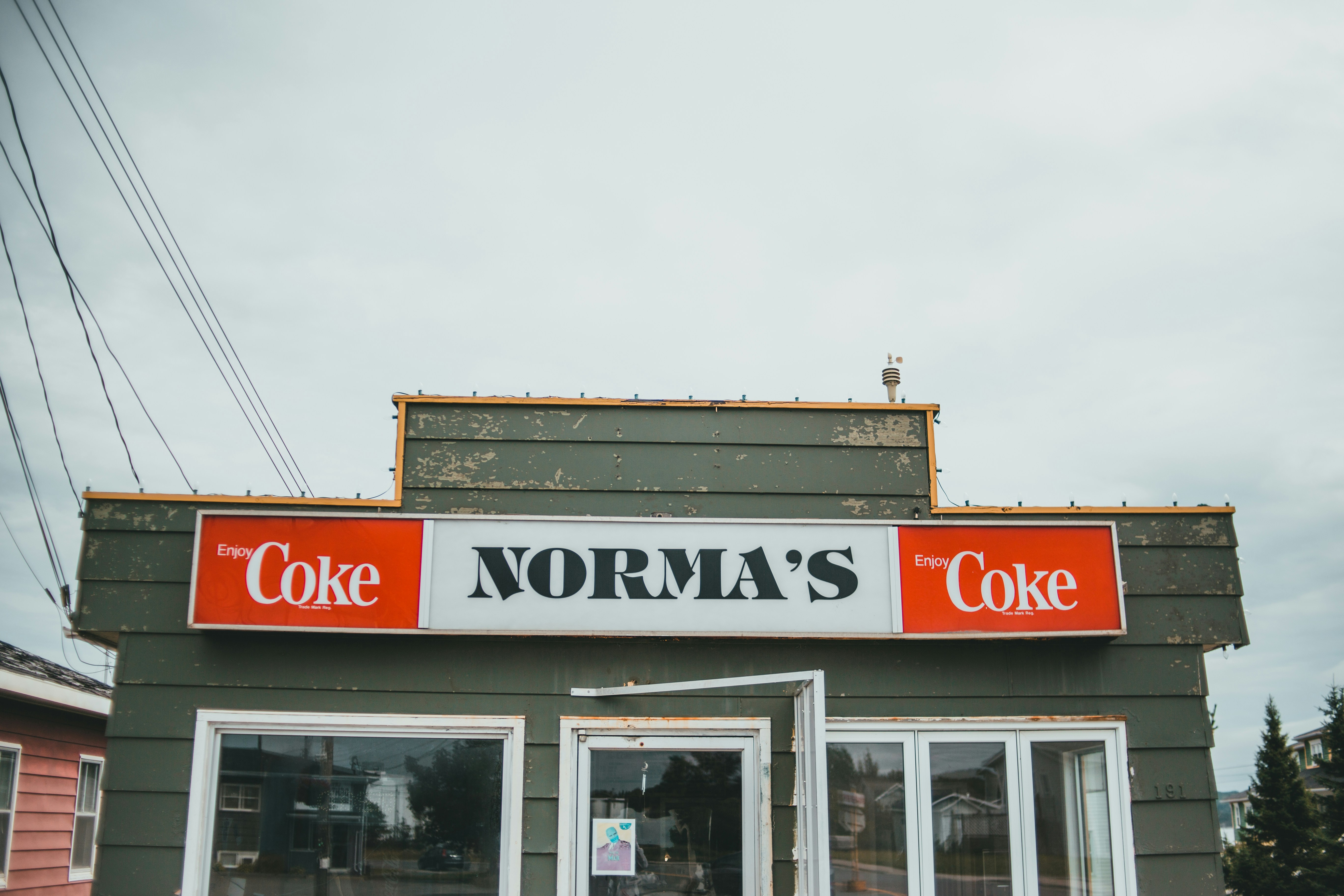 A store front with a coke sign above it photo – Free Food Image on Unsplash