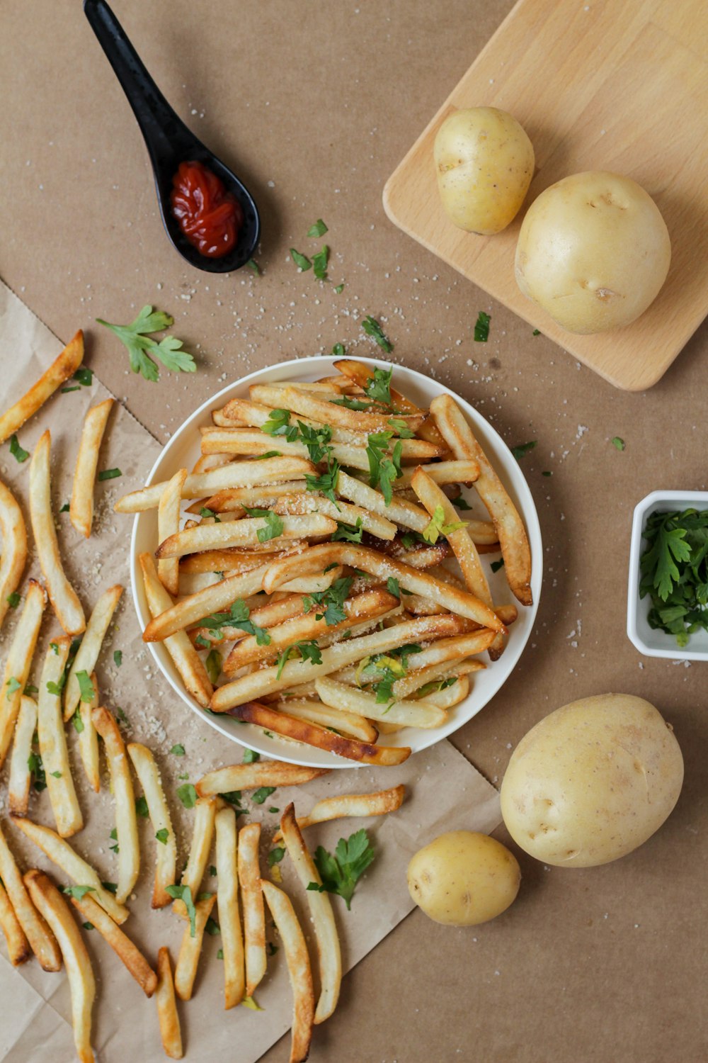 potato fries and sliced potato on white ceramic plate