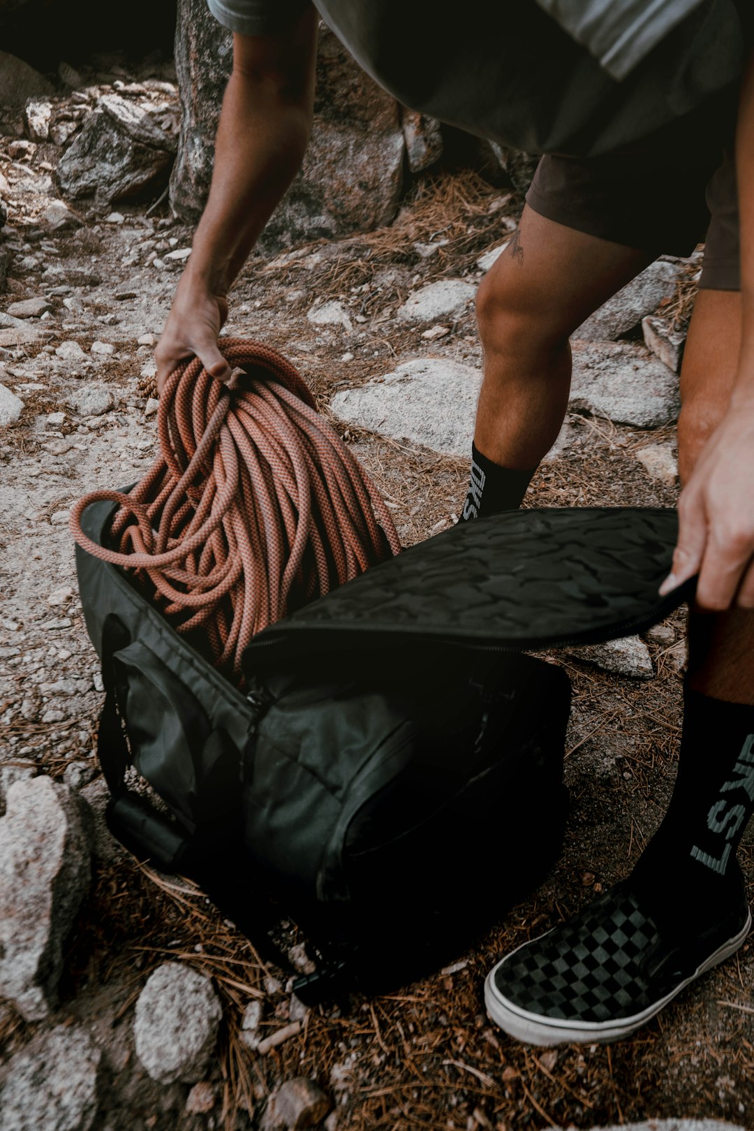 person holding brown woven basket