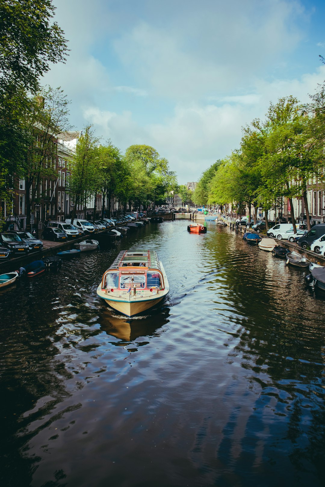 white and blue boat on river during daytime