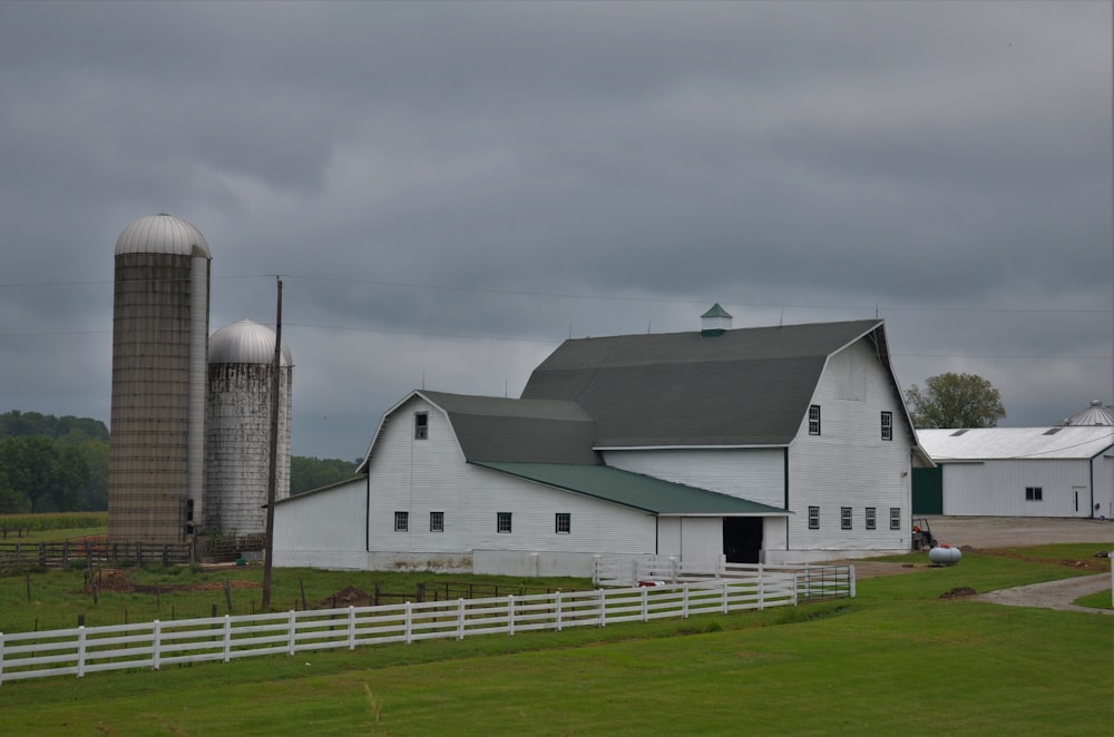 white and gray house under gray sky