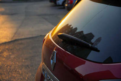 Evening shot of a Clearvista technician finishing a windshield repair under soft lighting.
