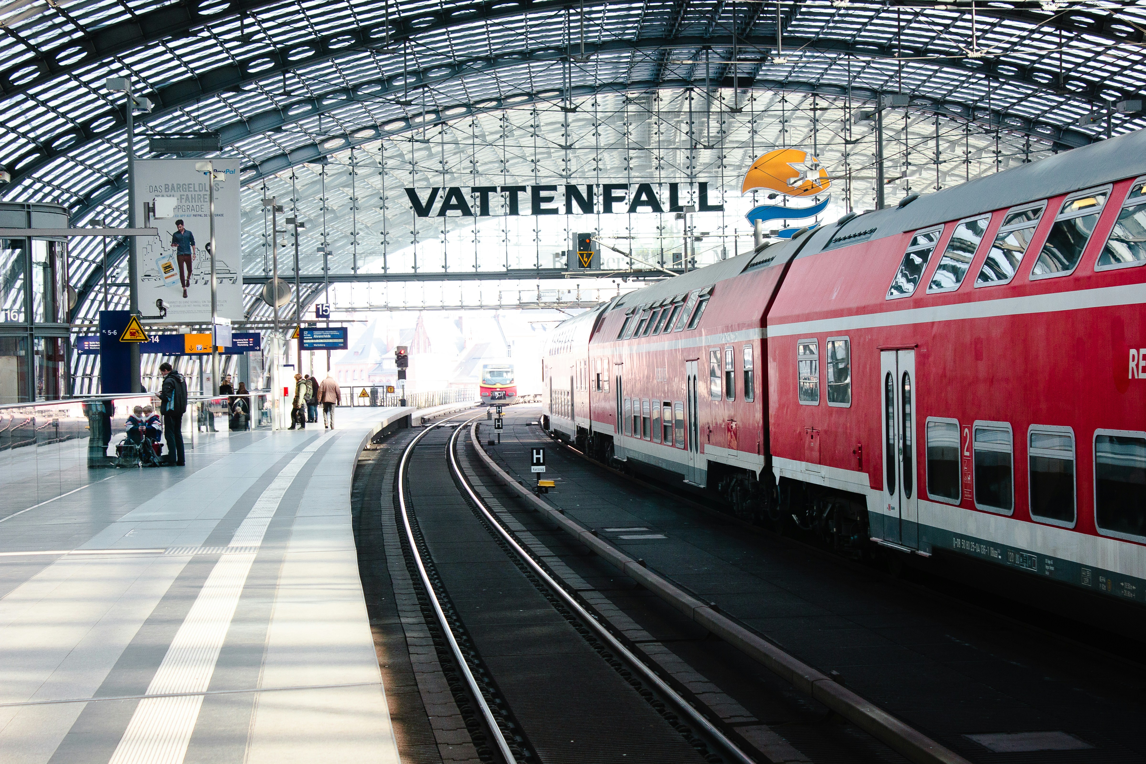 red and white train on train station