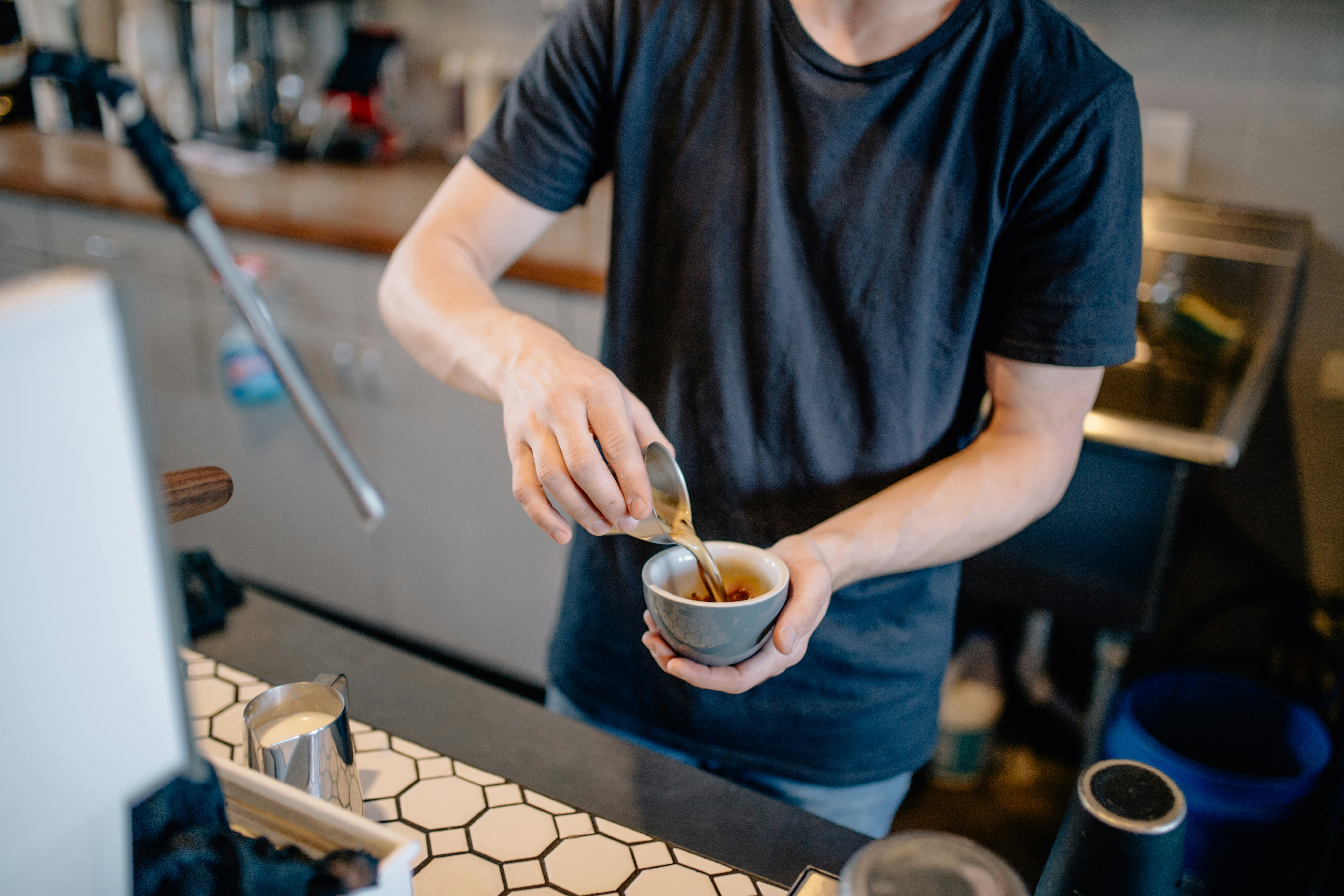 Barista serving in a coffee shop — illustrating What Is an LLC? Limited Liability Companies, Explained in Plain English.