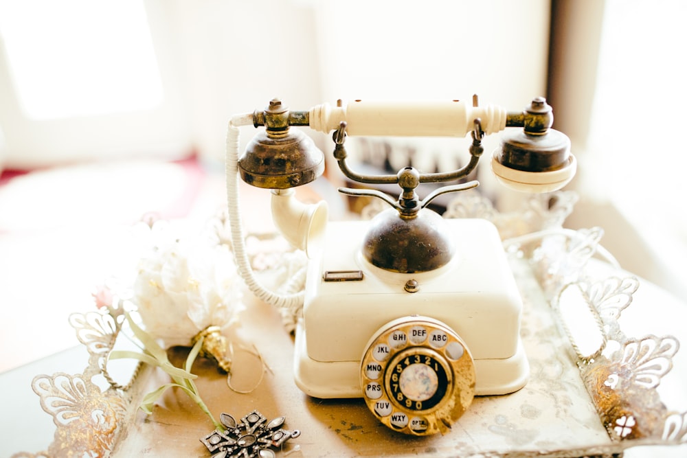 white and black rotary phone