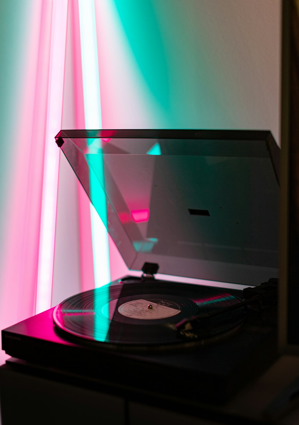 black and gray turntable on table