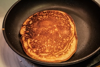 brown and black pastry on black pan