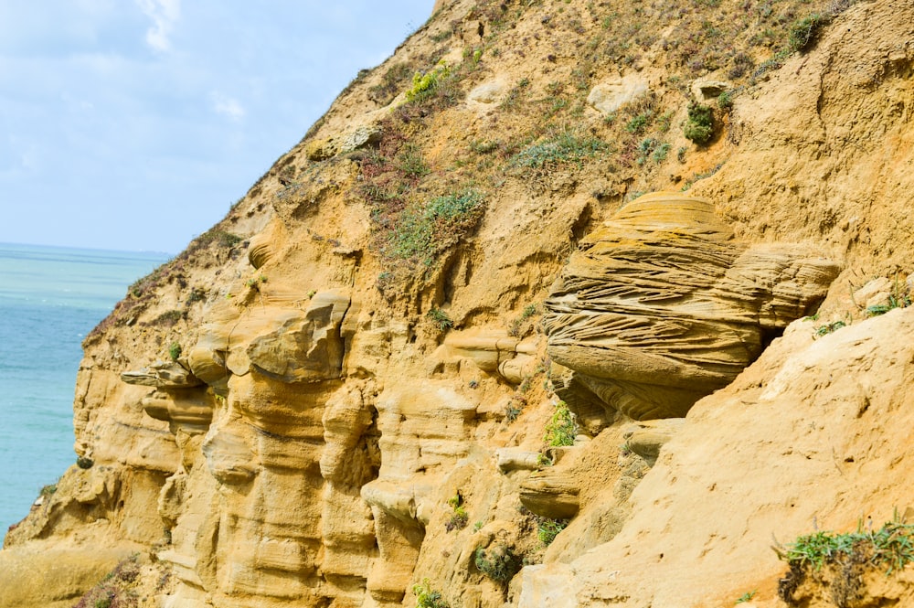 brown rock formation under blue sky during daytime