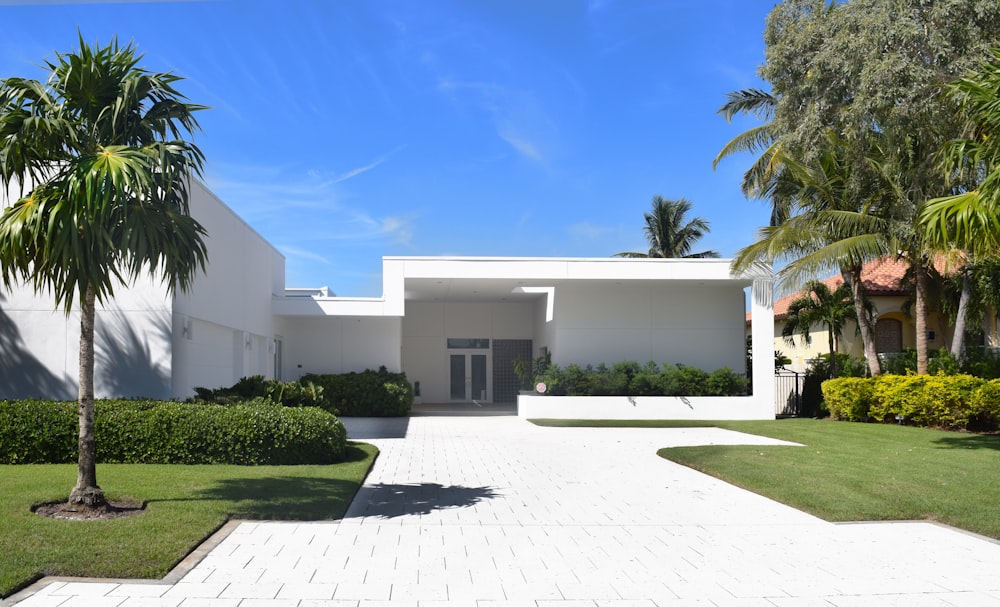 white concrete building near green grass field during daytime