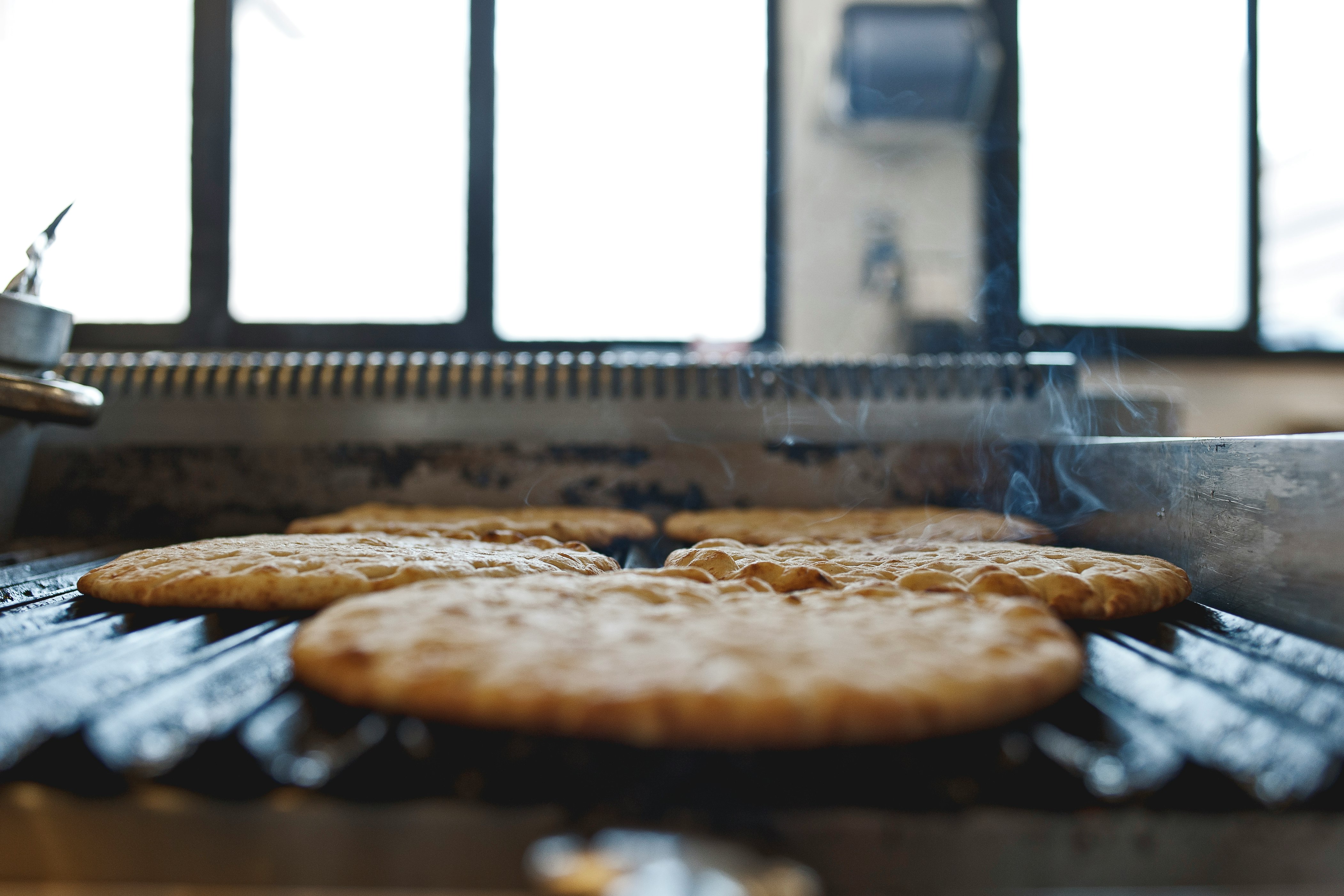 brown and black pie on stainless steel tray