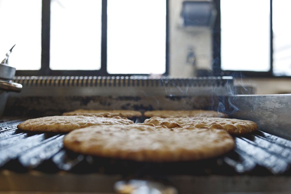 brown and black pie on stainless steel tray