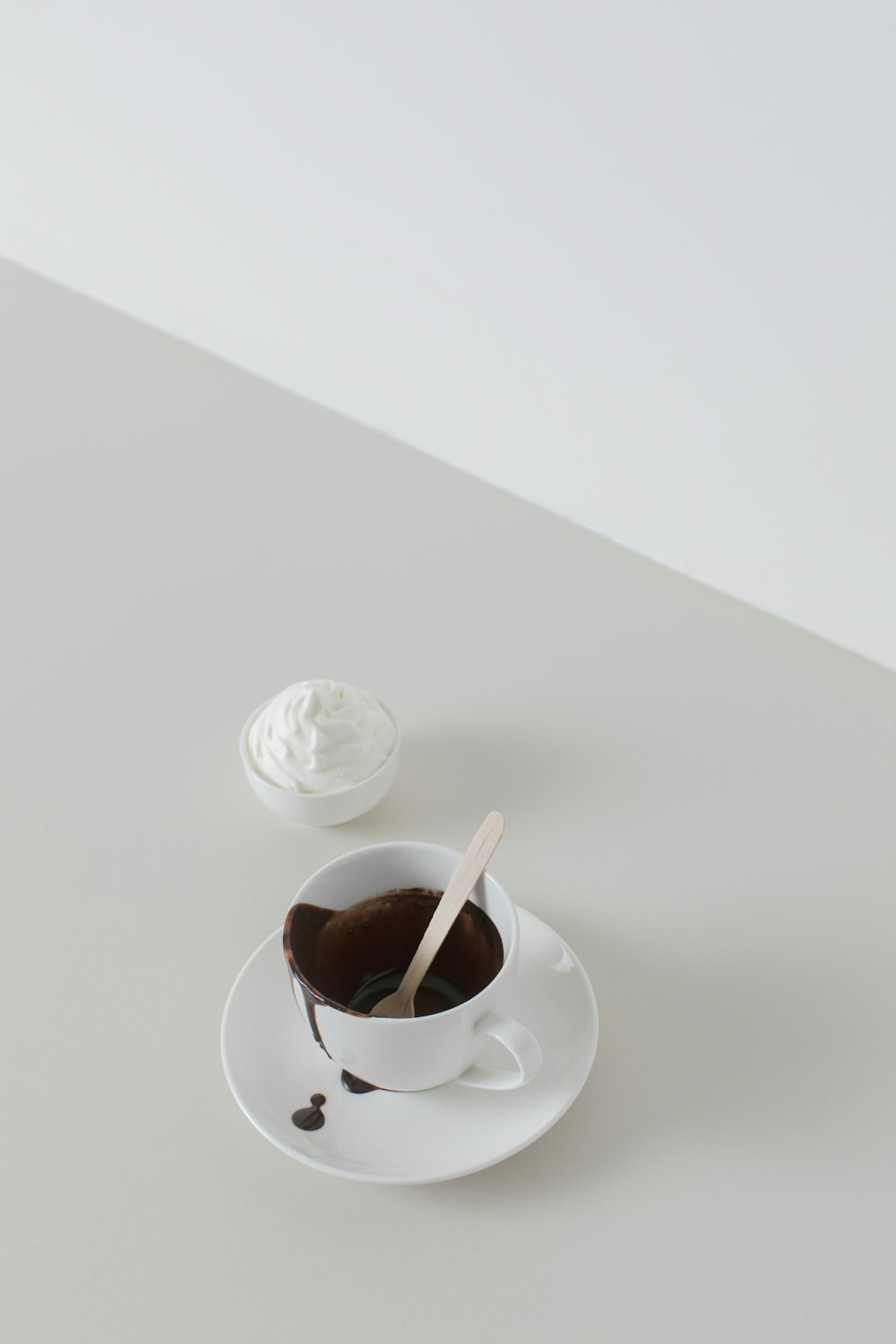 white ceramic cup on white ceramic saucer
