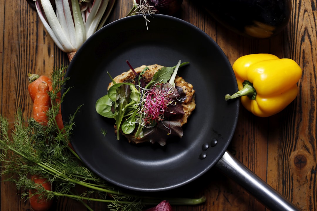 vegetable salad on black plate, A vegetable restaurant recipe on a pot.