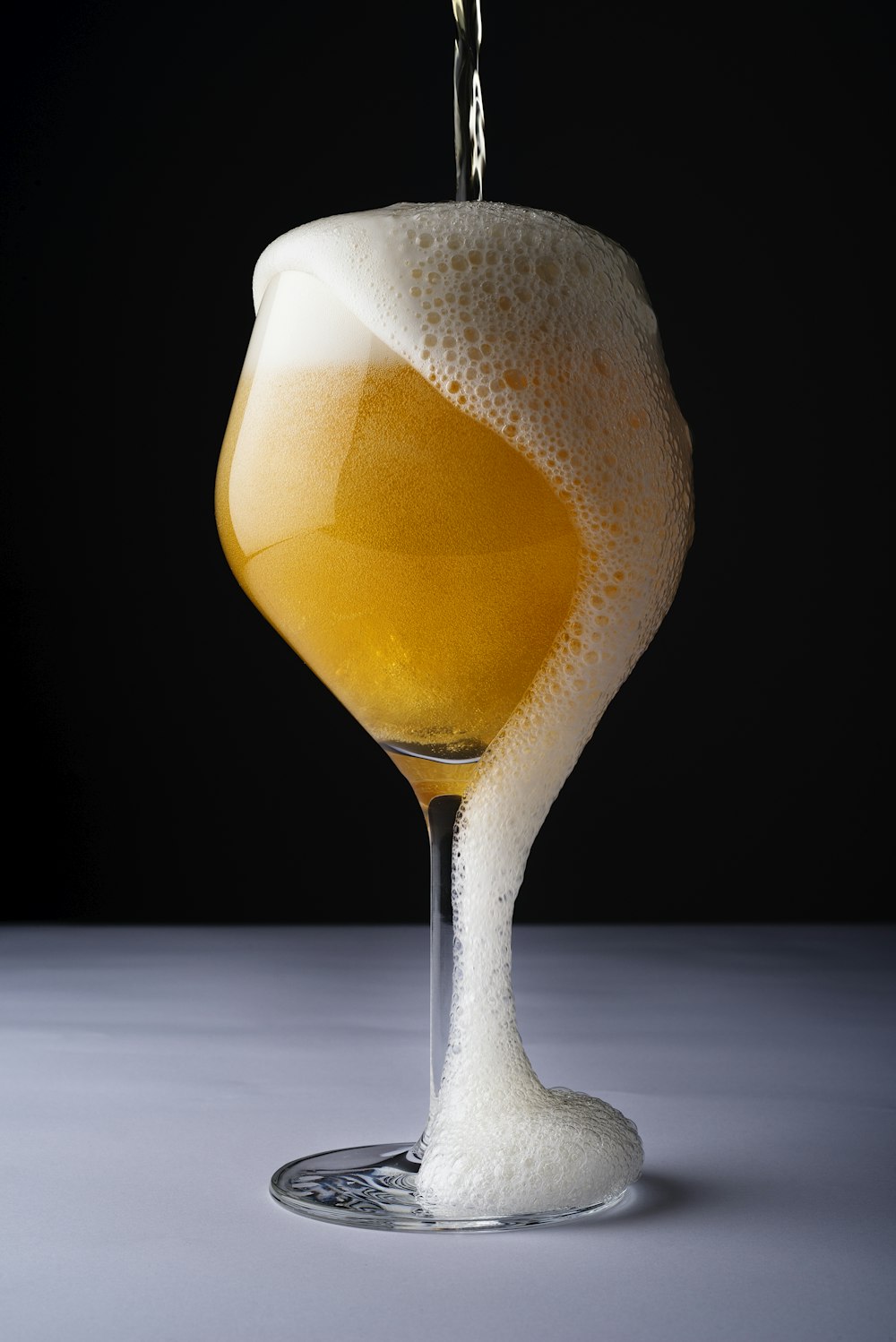 clear drinking glass with yellow liquid