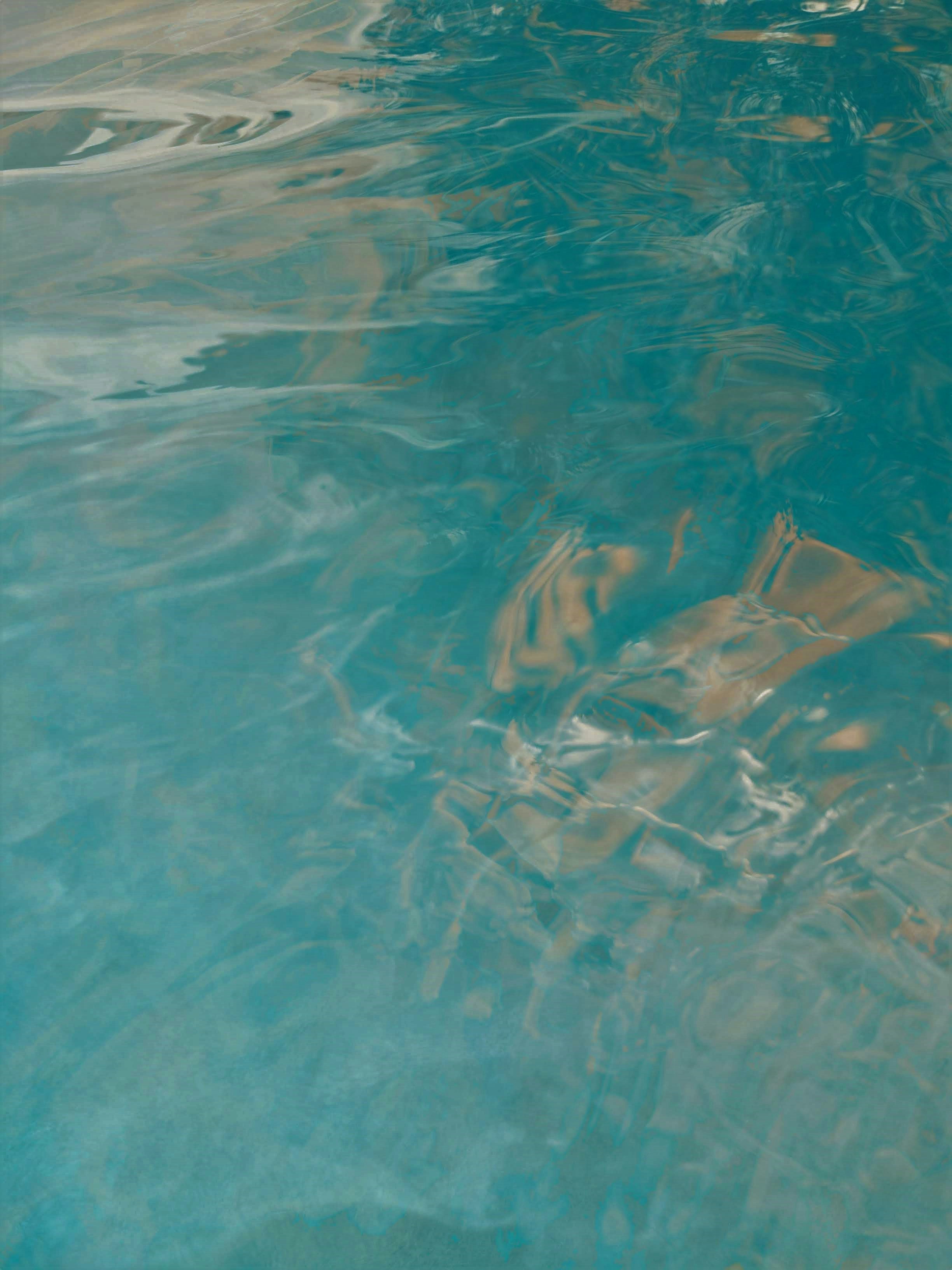 brown and white stripe textile on body of water