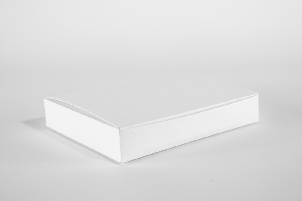 white wooden table on white surface