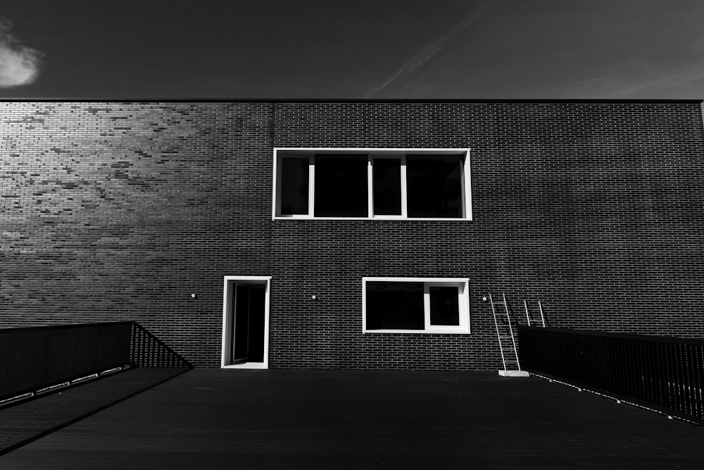 grayscale photo of 2 storey building
