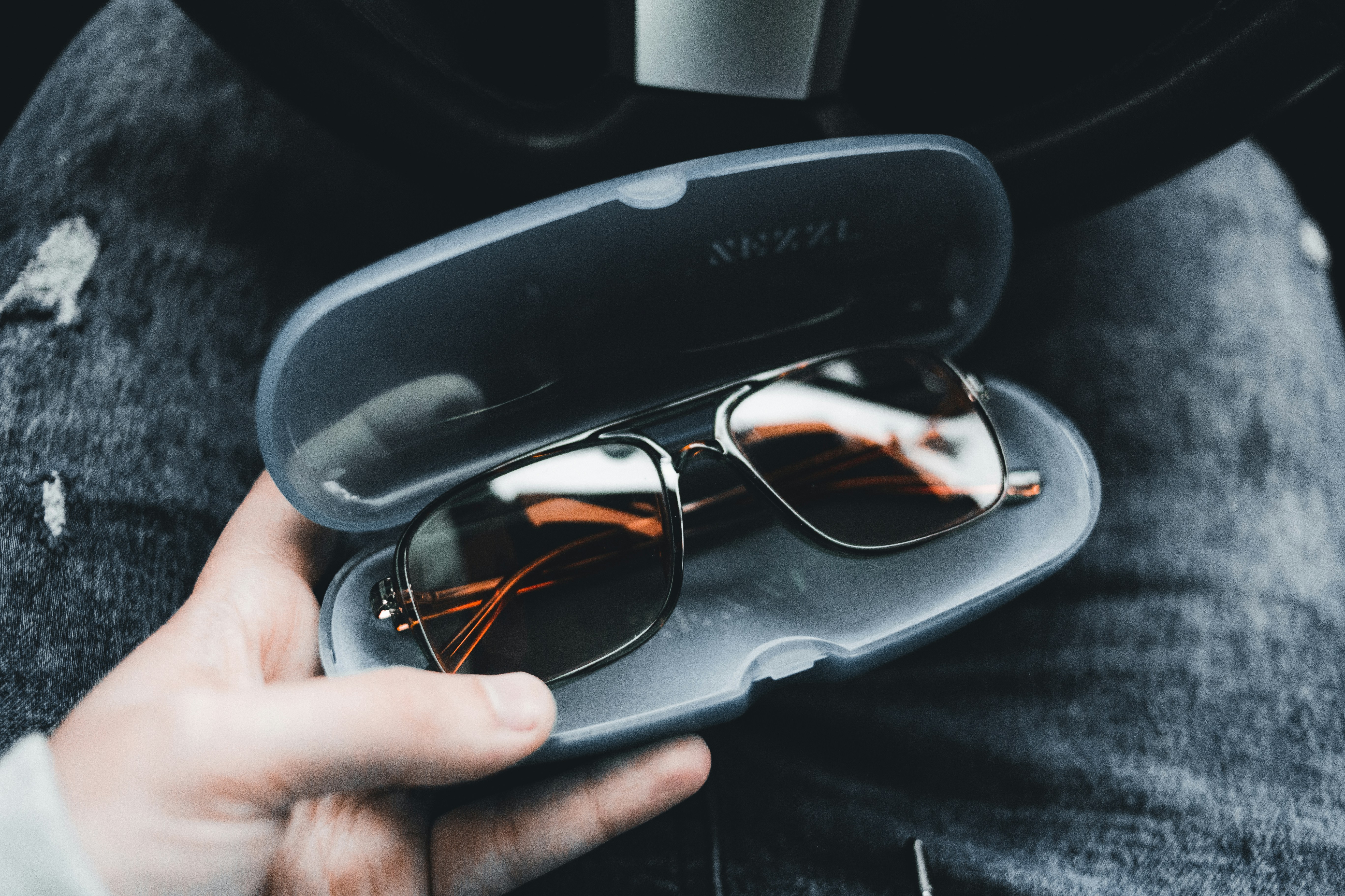 black framed eyeglasses on black case