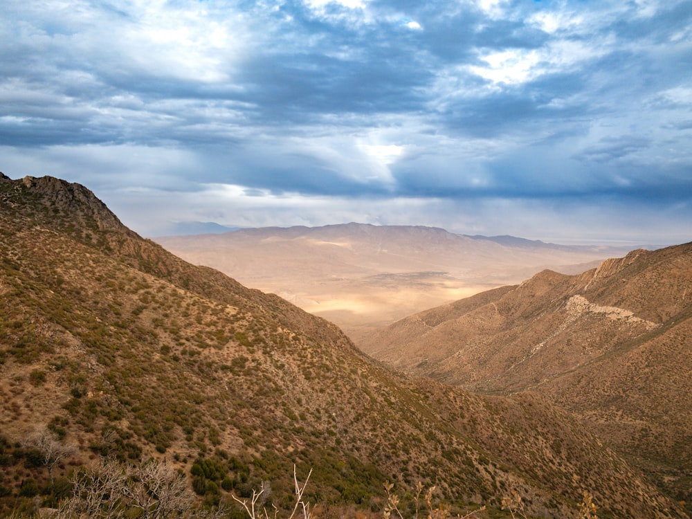 green and brown mountains under blue sky during daytime