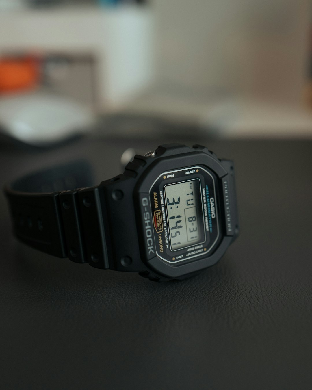 black casio digital watch at 11 00