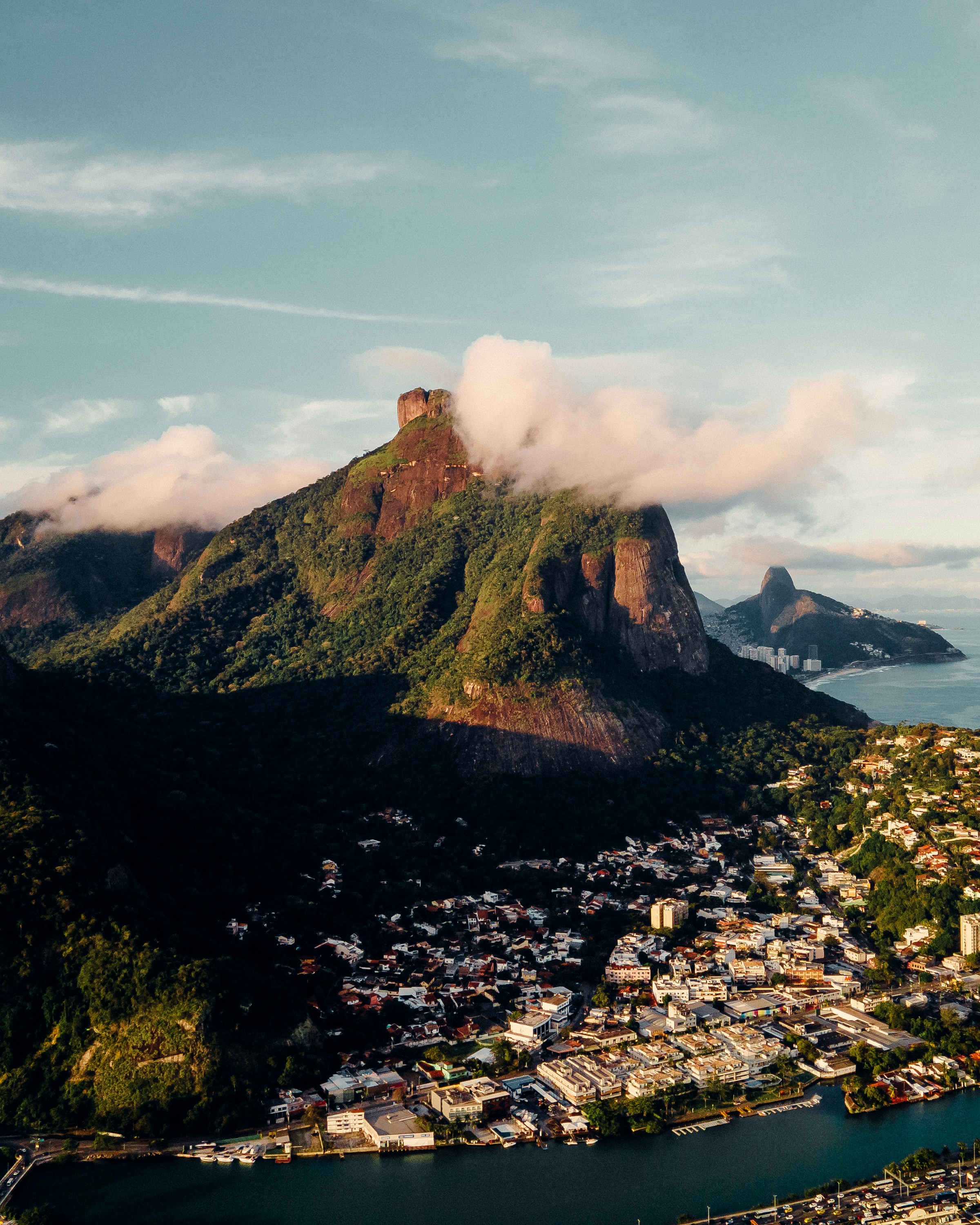 green and brown mountain under white clouds during daytime