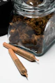 brown wooden rolling pin beside clear plastic pack