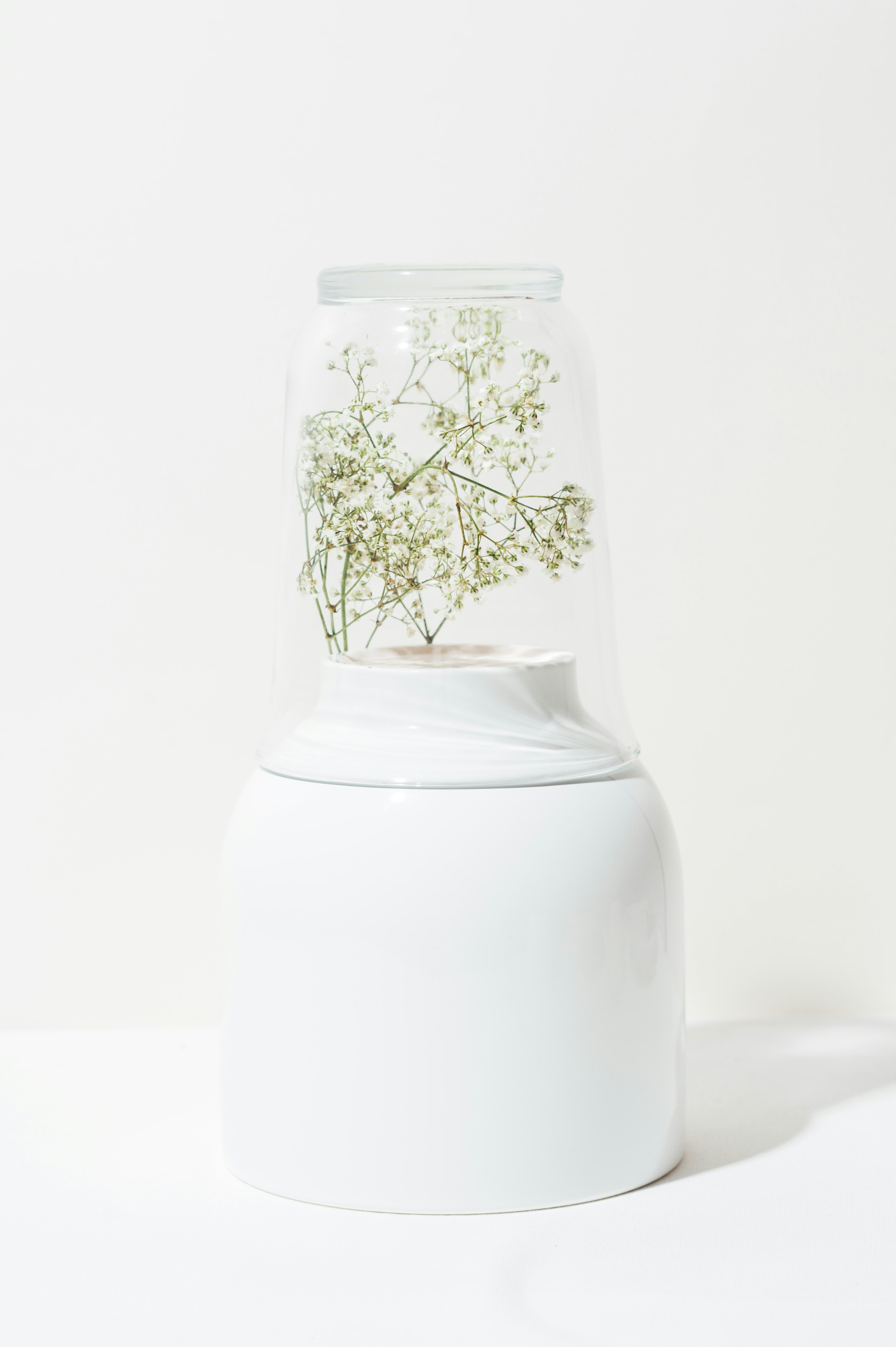 white and brown floral glass vase