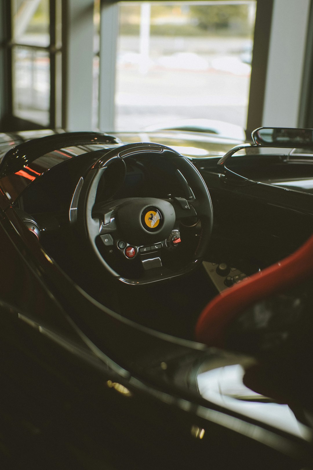 black and red bmw car steering wheel