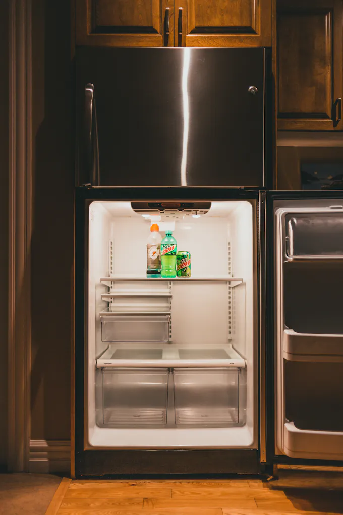 Refrigerator with a built-in ice and water dispenser serviced by an Altoona appliance repair technician
