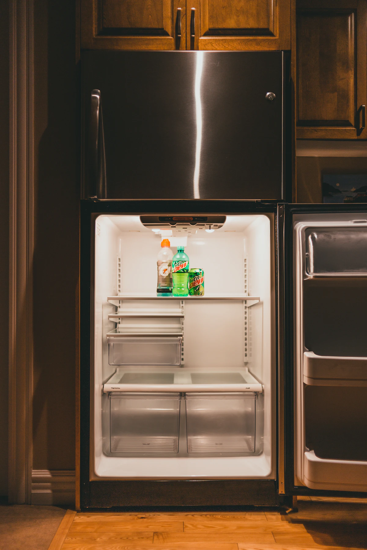 Refrigerator with the doors open during a cooling diagnosis