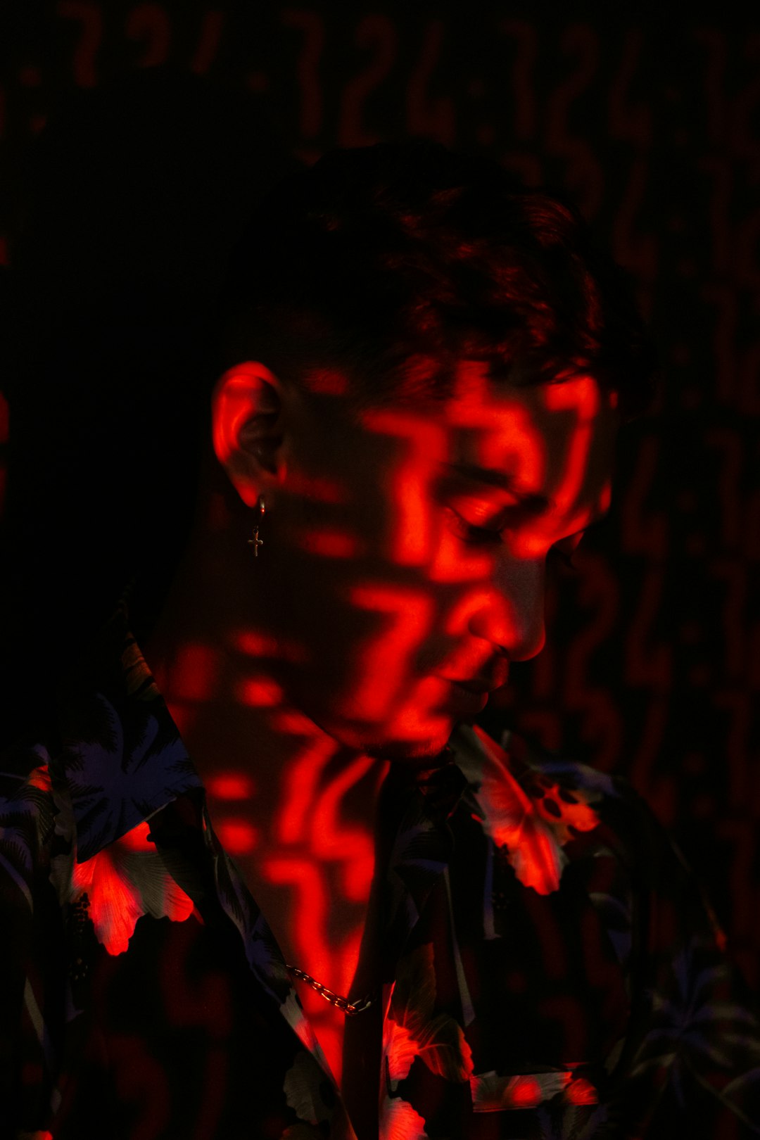 man in black and red floral shirt