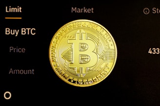 gold round coin on black surface