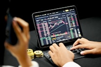 person using black tablet computer